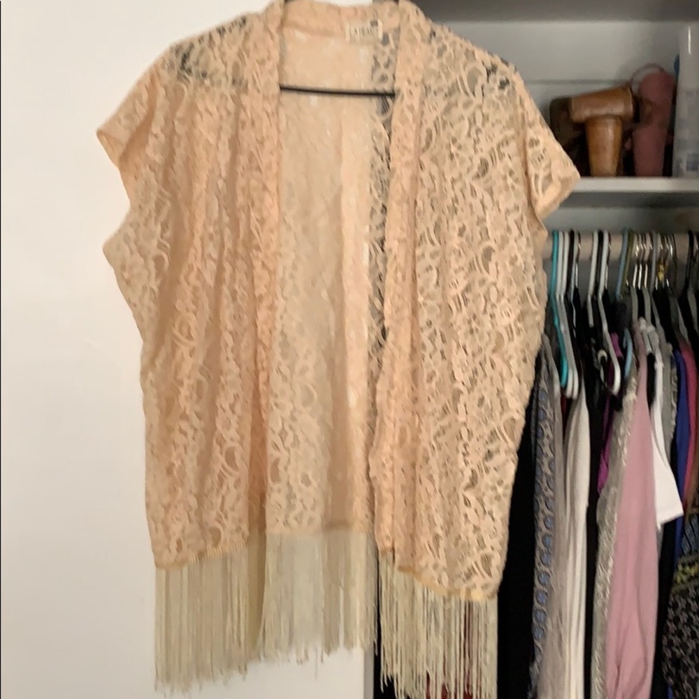 Lace throw open front. Ivory color with tassels